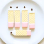 cute back to school wafer pencil cookies on white plate