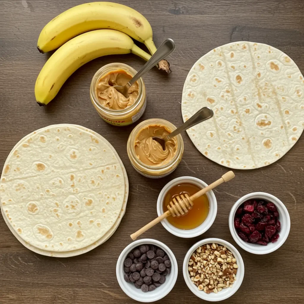 Ingredients for Peanut Butter Banana Roll Ups including bananas, peanut butter, and tortillas