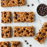 Protein Granola Bars with oats and chocolate chips on marble background