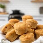 baby applesauce muffins served on a white napkin in a dish