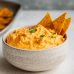 crock pot buffalo chicken dip in slow cooker with chips