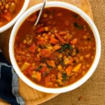 Best Lentil Soup Recipe served in a rustic bowl on a wooden table