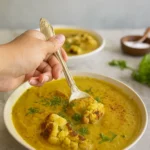Mediterranean Vegan Cauliflower Soup recipe served in a rustic bowl